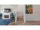 Modern staircase with light wood steps and white railings at 318 Windrush Blvd # 10, Indian Rocks Beach, FL 33785
