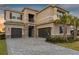 Two-story home with two-car garage and stone accents at 32317 Rosewood Meadow Ln, Wesley Chapel, FL 33543