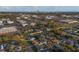 An aerial view of a house with a city skyline in the background at 3460 Reserve N Cir, St Petersburg, FL 33713