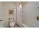 Bathroom features a shower/tub combo and white tile at 3829 Silver Strand Trl, Palmetto, FL 34221