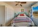 Bedroom with a teal bed frame and a ceiling fan at 3829 Silver Strand Trl, Palmetto, FL 34221