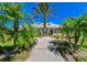 Community clubhouse with lush landscaping and walkway at 3851 Evergreen Oaks Dr, Lutz, FL 33558