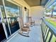 Peaceful balcony with rocking chairs, perfect for relaxing outdoors at 5207 Turquoise Ln # 202, New Port Richey, FL 34652