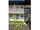 Condo building exterior with entrance and landscaping at 5207 Turquoise Ln # 202, New Port Richey, FL 34652
