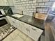Kitchen with white cabinets and dark countertops at 5207 Turquoise Ln # 202, New Port Richey, FL 34652