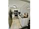 Updated kitchen with white cabinets and modern appliances at 5207 Turquoise Ln # 202, New Port Richey, FL 34652