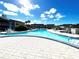 Inviting community pool with surrounding patio at 5207 Turquoise Ln # 202, New Port Richey, FL 34652