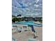 Inviting community pool with lounge chairs and plenty of space at 5207 Turquoise Ln # 202, New Port Richey, FL 34652