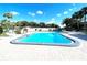 Enjoy this community pool with plenty of lounge chairs at 5207 Turquoise Ln # 202, New Port Richey, FL 34652