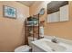 Small bathroom with toilet and sink at 5570 4Th N Ave, St Petersburg, FL 33710