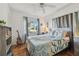 Main bedroom with a queen-size bed and large window at 5570 4Th N Ave, St Petersburg, FL 33710