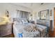 Cozy bedroom with a comfortable bed and wood floors at 5570 4Th N Ave, St Petersburg, FL 33710