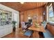 Dining area with wood paneled walls at 5570 4Th N Ave, St Petersburg, FL 33710