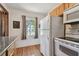 Kitchen with white appliances and granite counters at 5570 4Th N Ave, St Petersburg, FL 33710