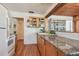 Kitchen boasts granite countertops and wood cabinets at 5570 4Th N Ave, St Petersburg, FL 33710