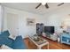 Living area with a couch, TV, and ample storage at 5570 4Th N Ave, St Petersburg, FL 33710
