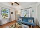 Living room with a comfortable couch and glass coffee table at 5570 4Th N Ave, St Petersburg, FL 33710