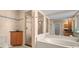 Spa-like bathroom with walk-in shower, soaking tub, and tile flooring at 6000 51St S St, St Petersburg, FL 33715