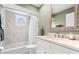 Updated bathroom with a bathtub, shower, and new vanity at 6000 51St S St, St Petersburg, FL 33715