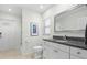 Clean bathroom with granite countertop and white cabinets at 6000 51St S St, St Petersburg, FL 33715