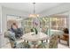 Bright breakfast nook with pool view, seating for four at 6000 51St S St, St Petersburg, FL 33715