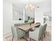 Formal dining room with large table and chandelier at 6000 51St S St, St Petersburg, FL 33715