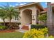 Front entryway with lush landscaping and stone steps at 6000 51St S St, St Petersburg, FL 33715