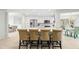 Open concept kitchen with island seating and white cabinetry at 6000 51St S St, St Petersburg, FL 33715