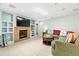 Living room with fireplace and built-in shelving units at 6000 51St S St, St Petersburg, FL 33715