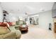 Spacious living room with sectional sofa and view into kitchen at 6000 51St S St, St Petersburg, FL 33715