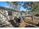 Wooden deck with grill and seating area, overlooking backyard at 6410 78Th N Ave, Pinellas Park, FL 33781