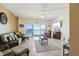 Living room with ocean view, comfy seating and tiled floors at 880 Mandalay Ave # C1103, Clearwater Beach, FL 33767