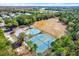 Aerial view showing tennis courts, playground, and basketball court at 8905 Breland Dr, Tampa, FL 33626