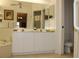 Bright bathroom features double sinks and a toilet at 7108 Saint Andrews Ln, Sarasota, FL 34243