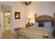 Main bedroom with large bed and access to bathroom at 7108 Saint Andrews Ln, Sarasota, FL 34243