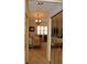 Bedroom with mirrored closets and a chandelier at 7108 Saint Andrews Ln, Sarasota, FL 34243
