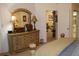 Main bedroom with large dresser and access to another room at 7108 Saint Andrews Ln, Sarasota, FL 34243