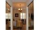 Bedroom with mirrored closet doors and window with shutters at 7108 Saint Andrews Ln, Sarasota, FL 34243