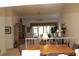 Spacious dining area with wood table and access to the living room at 7108 Saint Andrews Ln, Sarasota, FL 34243