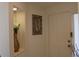 Bright condo entryway with decorative vase and artwork at 7108 Saint Andrews Ln, Sarasota, FL 34243