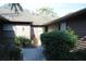 Exterior view of condo with landscaped walkway at 7108 Saint Andrews Ln, Sarasota, FL 34243