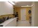 Bright kitchen with white cabinets and yellow walls at 7108 Saint Andrews Ln, Sarasota, FL 34243