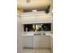 Bright kitchen with white cabinets and stainless steel appliances at 7108 Saint Andrews Ln, Sarasota, FL 34243