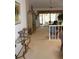 View of living room and access to lanai at 7108 Saint Andrews Ln, Sarasota, FL 34243