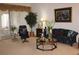 Living room with comfortable seating and large artwork at 7108 Saint Andrews Ln, Sarasota, FL 34243