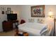 Living area features a comfy couch and a large TV at 7108 Saint Andrews Ln, Sarasota, FL 34243