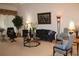 Living room with comfortable seating and large artwork at 7108 Saint Andrews Ln, Sarasota, FL 34243