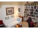 Home office with built-in bookshelves and seating area at 7108 Saint Andrews Ln, Sarasota, FL 34243