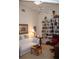 Home office features built-in bookshelves and a comfy couch at 7108 Saint Andrews Ln, Sarasota, FL 34243