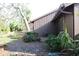 Small patio with table and chairs, near trees at 7108 Saint Andrews Ln, Sarasota, FL 34243